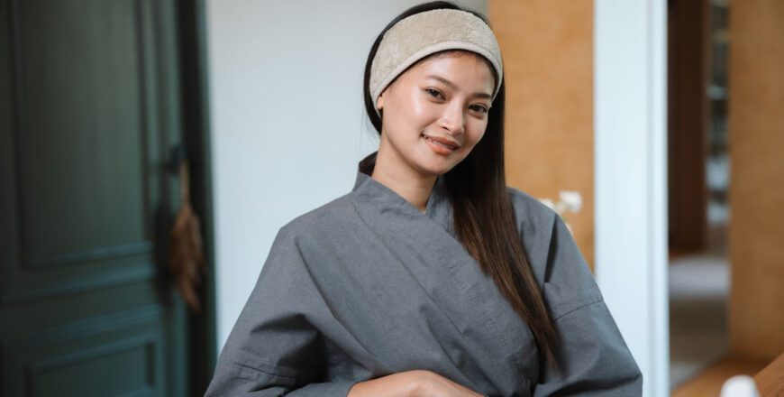 woman-in-a-robe-and-headband-sitting-in-a-chair